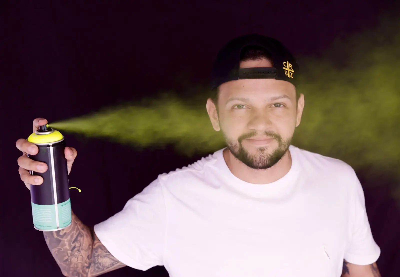 Renner Cruz painting a vibrant canvas